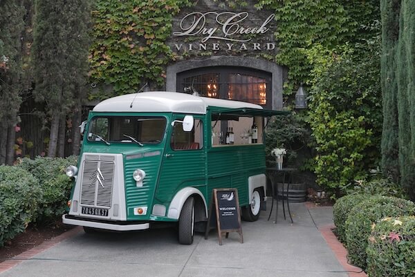 Our fully restored classic van, Claudine, in front of the cellar in the wine garden.